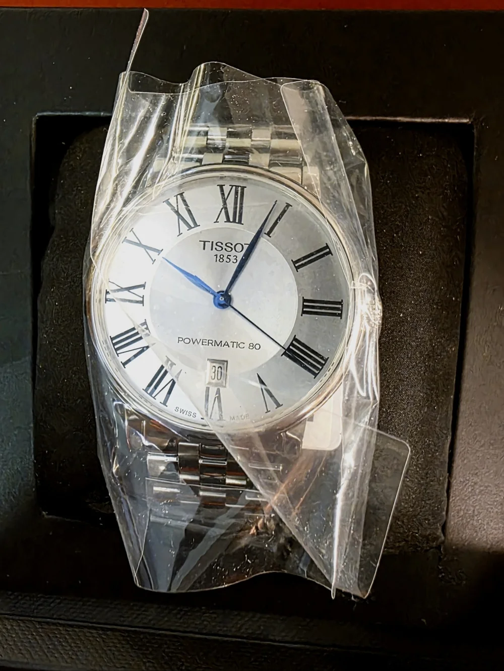Tissot Silver Watch with Blue Hands and White Dial